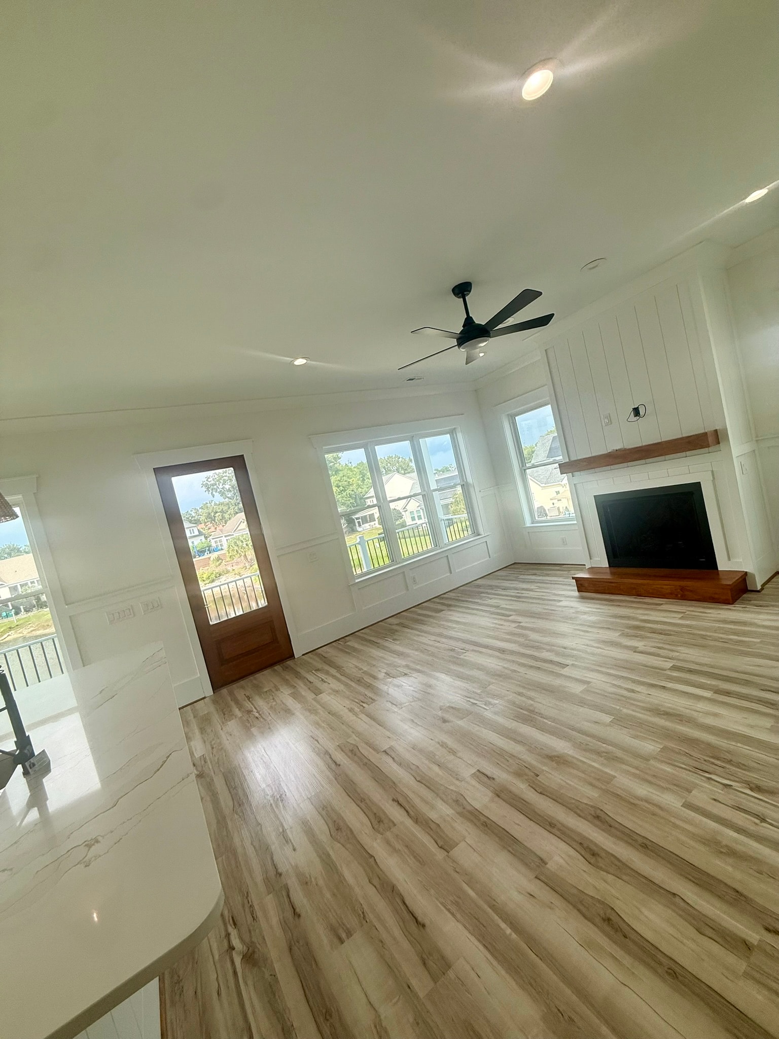 Open living room with fireplace and hardwood floors